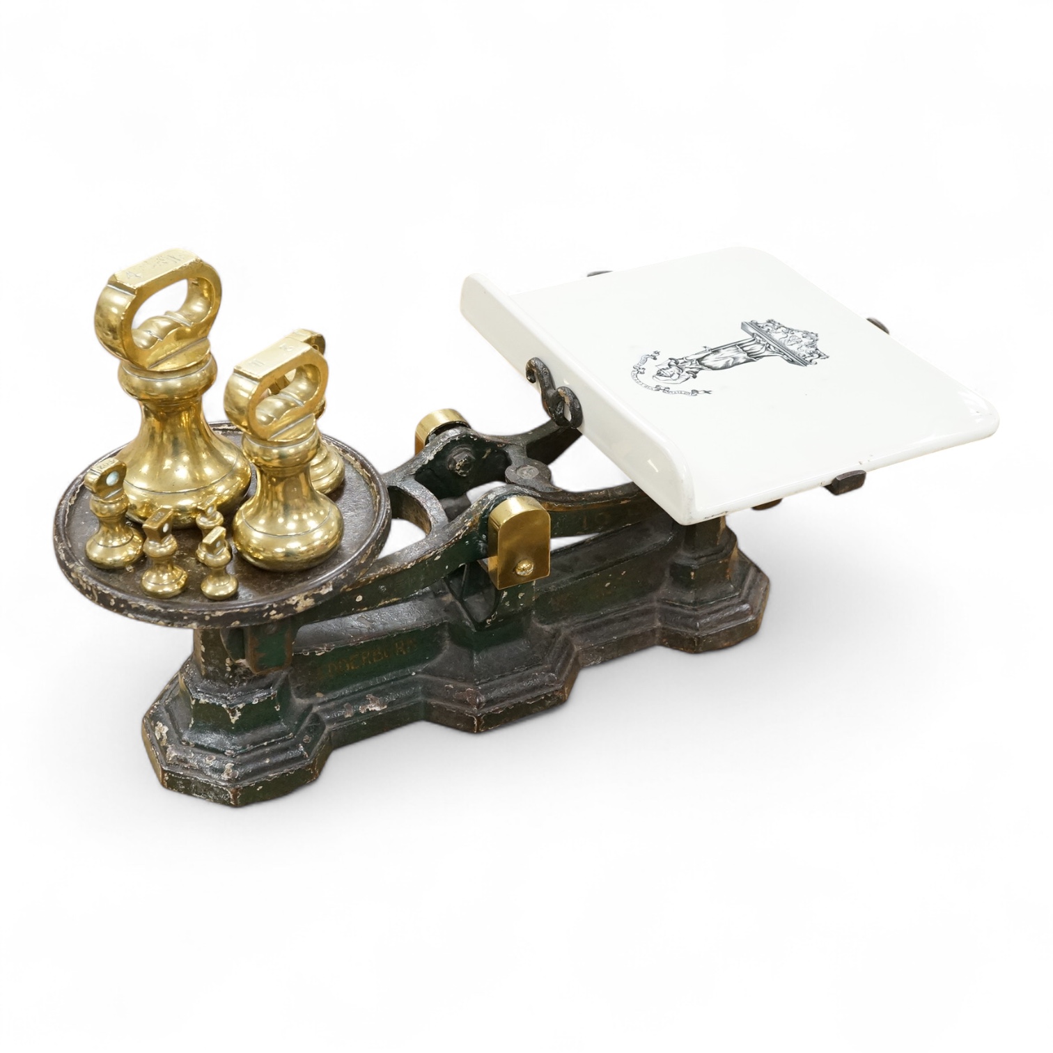 A set of Victorian iron and ceramic scales and seven brass weights, 53cm wide